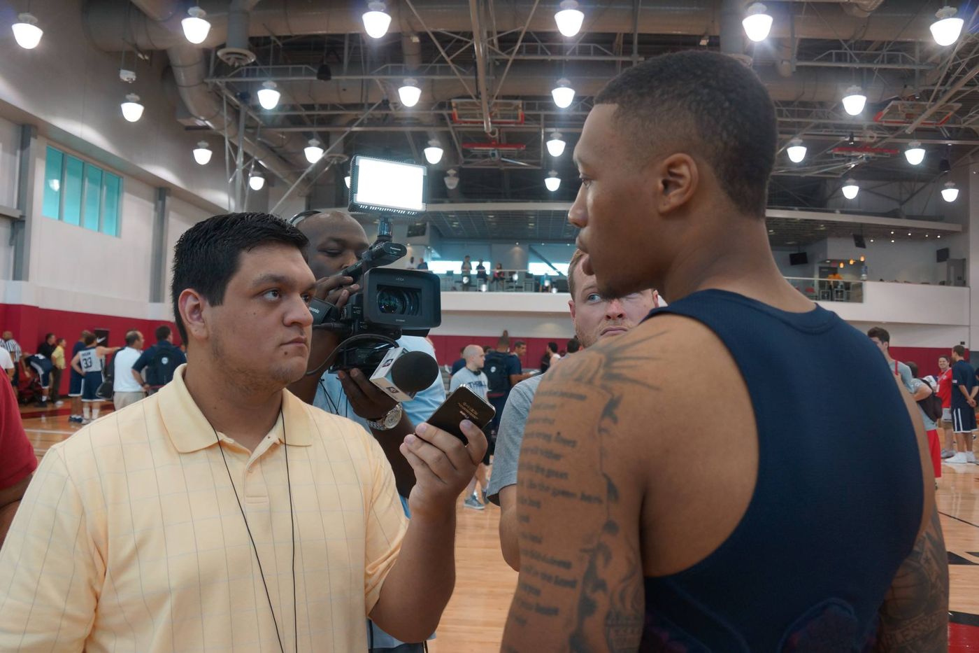 Mark Travis interviewing Damian Lillard at a USA Basketball minicamp